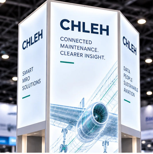 Tall backlit aviation brand tower with illuminated aircraft graphics and branding on multiple faces