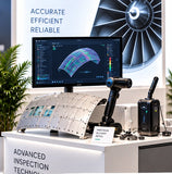 Aviation inspection demonstration counter displaying an aircraft panel sample, handheld scanner and inspection visualization screen